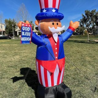 Bandera inflable del tio Sam con Dios bendiga de USA